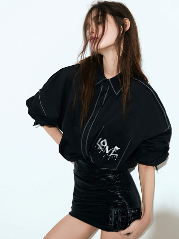 Black faux leather mini skirt with draping, 2