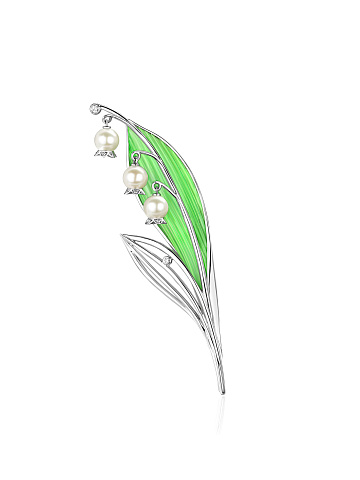 White gold brooch with pearls, light green enamel and diamonds, 1