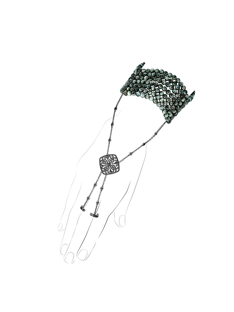 Slave bracelet in blackened gold with diamonds and “cat’s eye” beads, 1